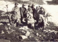 Men hunkered down on the side of Monte Cassino [Courtesy of Ed Ikuma]