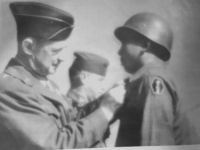 Mansaku Fujita receiving his Bronze Star medal.  [Courtesy of Wayne Fujita].