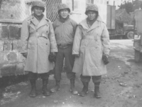 Three soldiers pose for a photo in their winter gear, 1944. [Courtesy of Mary Hamasaki]