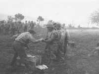 Red Cross women pass out doughnuts and coffee to 100th Battalion soldiers in Italy, 1944. [Courtesy of Mary Hamasaki]