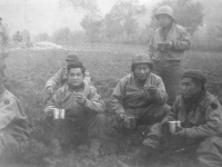 Soldiers gather around for a meal. [Courtesy of Mary Hamasaki]