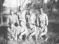 Eight soldiers pose for a group photo. [Courtesy of Mary Hamasaki]