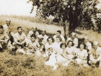 Japanese American (Hawaiian) 100th Infanty soldiers with Hendersin family members in orchard. BACK L to R: Richard, George, Unknown, Thomas, James Hendersin, Harold, Unknown, Unknown. MIDDLE L to R: Donleigh Gaunky, Ralph Hendersin Jr., Nancy Hendersin, Friend, Joanne Hendersin, Betty Hendersin, Dolores Hendersin. FRONT: Bobby Hendersin. [Courtesy of Monroe County Local History Museum, Sparta, Wisconsin. Jarrod Roll, Director, Jan 8, 2019]