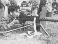 Kawasaki on the machine gun [Courtesy of Kenneth Higa]