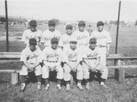 The outfielders of the 100 Infantry ball team. I am the small one on the team. [Courtesy of Leslie Taniyama]