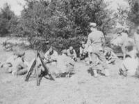 Snap of our platoon taking a "break" or rest period during drill hours at drill field at New Camp McCoy.  [Courtesy of Jan Nadamoto]