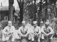 A candid shot of us taking a rest after just walking around at LaCrosse.  L to R: James Komatsu, Fred Kanemaru, myself & Richard Ogura.  In the side standing is Yukio Yokota.  [Courtesy of Jan Nadamoto]