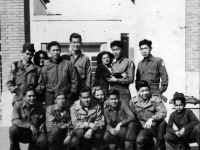 Co. “B” Boys in Italy Bottom Left to right: Soichi Harada, Sonny Kane, ?, ?, James Mizuno, Italian boy.  Back row, left to right: Paul Akama, Italian woman, Takashi Sandow, Toshio Santoki, Italian Woman, ?, Takuma Honke [Courtesy of Robert Arakaki]