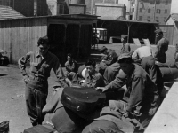 Bernard Akamine and friends wait with their belongings in Italy [Courtesy of Robert Arakaki]