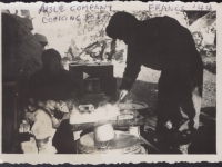 Able Company cooking food in France, 1944. [Courtesy of Fumie Hamamura]