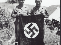 Two soldier hold the nazi flag. [Courtesy of Fumie Hamamura]