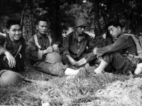 Morihara, Miyashiro, Stanley Hamamura, and Hirokawa resting after a hike at Camp McCoy, July 1942 [Courtesy of Fumie Hamamura]