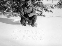 Stanley Hamamura writes his and Fumie’s name in the first snowfall at Camp McCoy, Wisconsin [Courtesy of Fumie Hamamura]