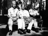 Stanley Hamamura, Itsuo Takahashi, and Isauis Inouye wait for the bus to Wisconsin Dells, 1942 [Courtesy of Fumie Hamamura]