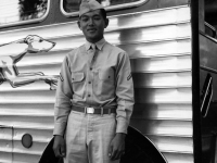 Stanley Hamamura in front of greyhound bus [Courtesy of Fumie Hamamura]