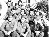 Message Center, Communications Section, Headquarters Co. Menton, France, December 1944. Front row: Raymond Sato, Kungo Iwai, Harold Tamashiro, Yoshio Ogomori. 2nd row: unknown, Fred Kurisu, Irish Ohara, Tom Fujise. 3rd row: Hiromu Heyamoto, Sam Hanashiro, G.I. Tanaka, Jockey Ishikawa. 4th row: Ed Ikuma, Keichi Kimura. (Courtesy of Kenneth Higa)