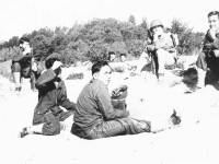 Taking a break during a manuever. 3rd from left: Fred Nakamura, ?, Ogata. [Courtesy of Sonsei Nakamura]