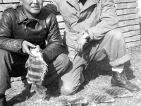 Ishii and Ono with their catch from Mississippi, November 1942 [Courtesy of Leslie Taniyama] Inscription: Reverse: Nov. 1942 Lt. Ishii - Cook. & yours truly T. Ono. Dec 31/1942