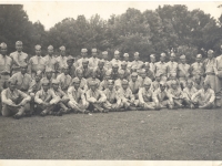 1st Platoon, Company E at Vilas Park in Madison, Wisconsin.  1st row: Cpl. Harry Yoshizaki, Jack Murata, Kiyoshi Yoshikawa, Chikami Hirayama, Soko Higa, Robert Toma, Kenji Nishimura, Tetsuo Sasaki, Masaya Saito, Yoshito Morikawa, Robert Fujimori.  2nd Row: Sgt. Ted Ebata, Hank Nakamura, Ben Murashima, Wasato Harada, Torao Yamada, Clarence Yamamoto, Takashi Suzuki, Isamu Nakasato, Goro Sumida, Tomiya Sato, Harry Nishie, Nifumi Yamada, Paul Oshiro, Katsumi Murai, Kiyoshi Furuichi.  3rd Row: Yasunori Matsumoto, Fred Matsuo, Mihoru Yoshimura, Raymond Taomae, Yutaka Inouye, Taketoshi Chigawa, Richard Oki. 4th Row: Cpl. Richard Hara, Haruo Doi, Yutaka Suzuki, Nobuo Serizawa, Yoshio Kubo, Takbo Takahashi, Shigeru Tanoue, Mike Nagaishi, Sidney Oshiro, Shigeki Ishikawa, Sabuko Hasegawa, Stanley Teruya, Tetsuo Kawano, Ronald Takara, Noboru Kaneko, Richard Kinoshita, Lt. K. Kuramoto, Sgt. Wm Kato