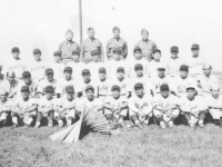 The 100th Battalion had a baseball team which competed against top teams in the state while stationed at Camp McCoy, Wisconsin. Team members and officers in this September 1942 photo are: front row L-R, Haruo Hayakawa, Yozo Yamamoto, Masaharu Takeba, Fred Wada, Wataru Kaneshina, Masahiko Miyagi, Yoshinao Omiya, Shunji Suzuki, Tadashi Ohta, Shigeo Igarashi. Second row L-R, Edward Mitsukado, Seiji Tanigawa, Shigeo Takata, Moichi Okazaki, Kenneth Kaneko, Toshio Mizusawa, Goro Moriguchi, Masaru Yamamoto, Hide Yamashita, Tadashi Matsunami, Ted Hirayama. Third row L-R, John Y.Yamada, Koichi Fukuda, Sam Tomai, Ronald Hamamura, Akira Akimoto, Al Nozaki, Henry Shiyama, Fumi Taniyama, Tadao Honbo, Mits Omori. Back row L-R, Capt. Katsumi Kometani, Col. Farrant Turner, Maj. James Lovell, Capt. Kiyoshi Kuramoto. (Courtesy of Sandy Tomai Erlandson)