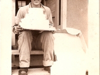 Shinyei Nakamine sits with his birthday cake with money sent from his mother to the officers at Camp McCoy. (Courtesy of Anita Korenaga)