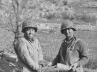 Holding remants of shell.  Left - Conrad Tsukayama.  Right - Kazuo Mizuno. Kauai boys.  [Courtesy of Herbert Sueoka]