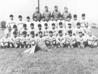 100th Infantry Ball Team - 1st Row  - Mascot, Yozo Yamamoto, Masa Takeba, Dan Ivada, Kaneshima, M. Miyagi, Y. Omiya, S. Suzuki. [Courtesy of Leslie Taniyama]