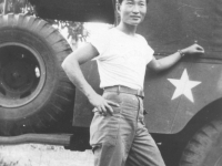 Tom Matsumura stands next to a jeep in the Philippines. [Courtesy of Florence Matsumura]