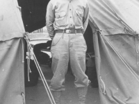 Tom Matsumura stands in front of his tent at Camp McCoy, Wisconsin. [Courtesy of Florence Matsumura]