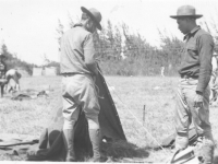 Setting up tents in the field. [Courtesy of Velma Nakahara]