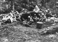 Hastily constructed medical tent in the middle of the Vosges Mountains. [Courtesy of US Army Signal Corps]